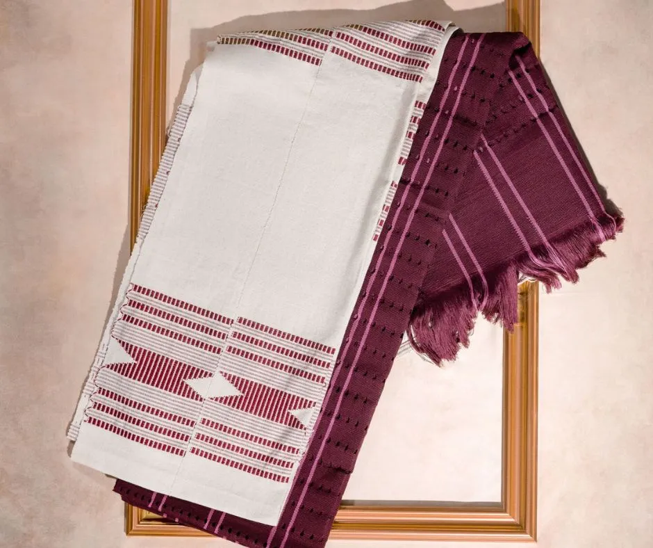 Finished authentic customised white and burgundy authentic Aso Oke fabric photographed artfully on a frame