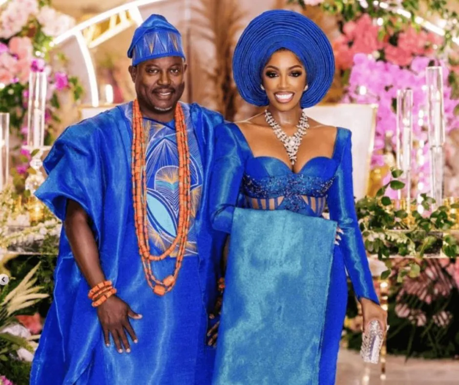 Simon Goubadia and Porscha williams in their matching blue aso oke wdding outfits